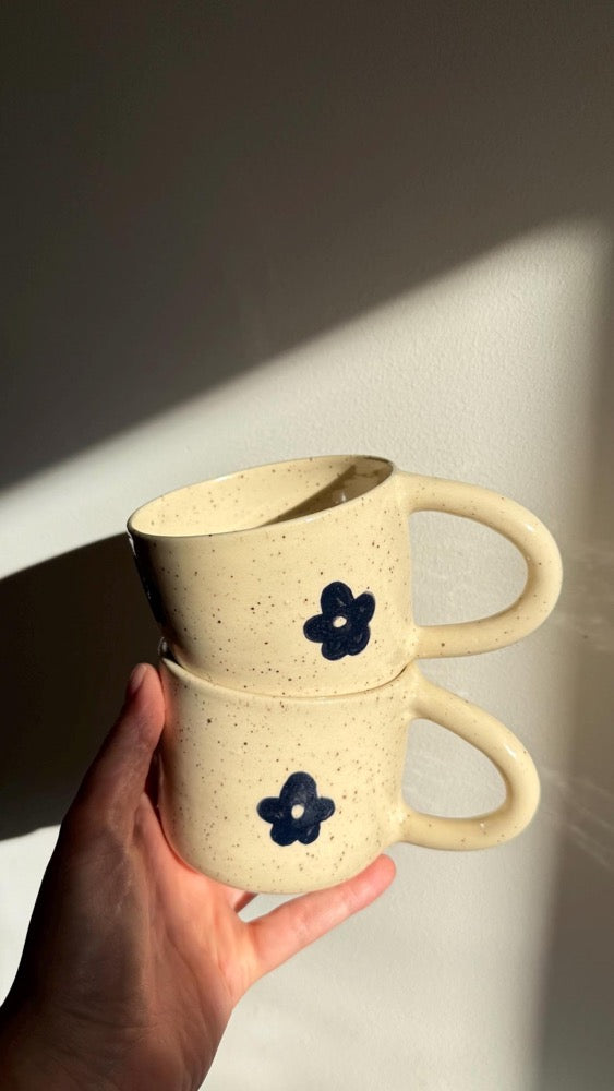Handmade mug with black flowers
