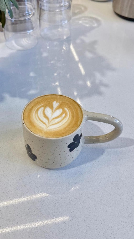 Handmade mug with black flowers