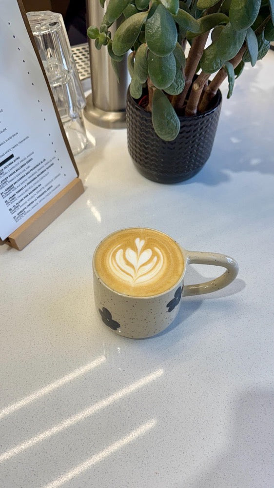 Handmade mug with black flowers